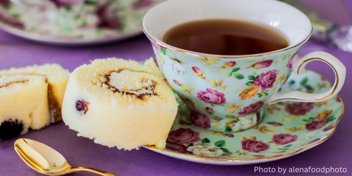 A floral English tea cup and cake