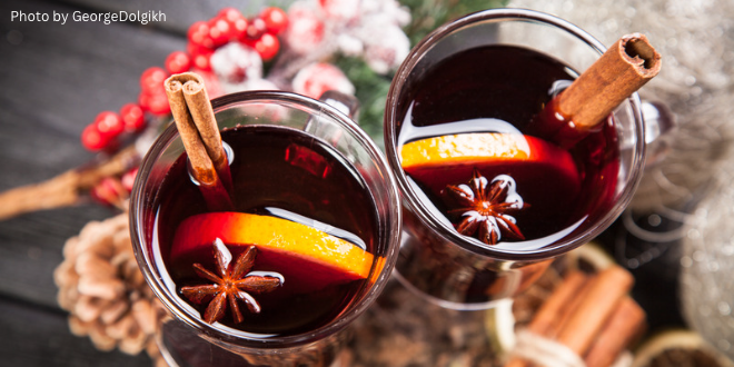 Two glasses of mulled wine with a number of spices