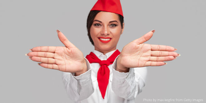 An air flight attendant giving clear instructions