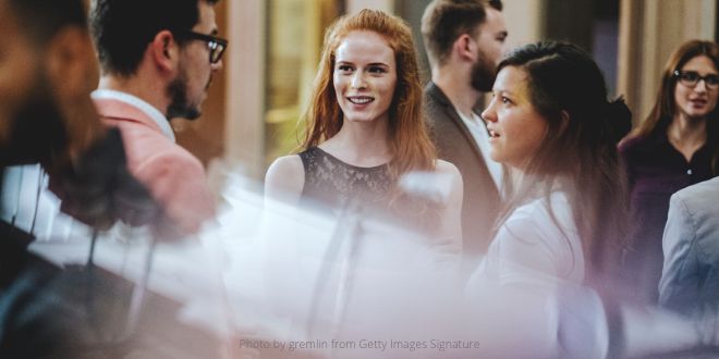 A group of young people talking to each other