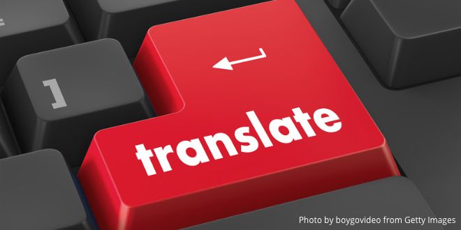 A red computer key with the word "translate" on it