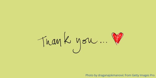 The words "thank you" in handwriting and a red heart on a green background