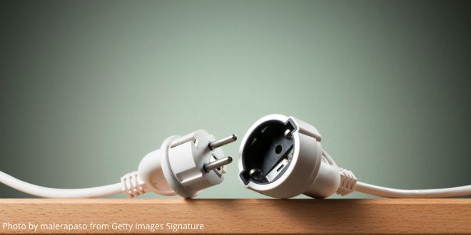 An electric cable with plug and socket unplugged