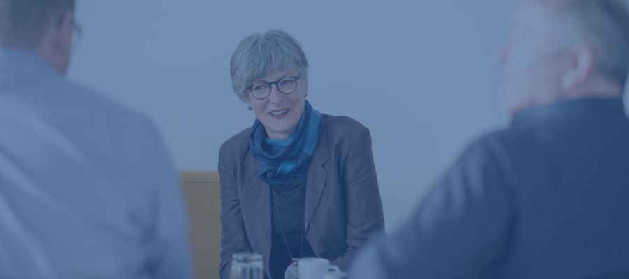 Christine talking to two business clients in Gummersbach
